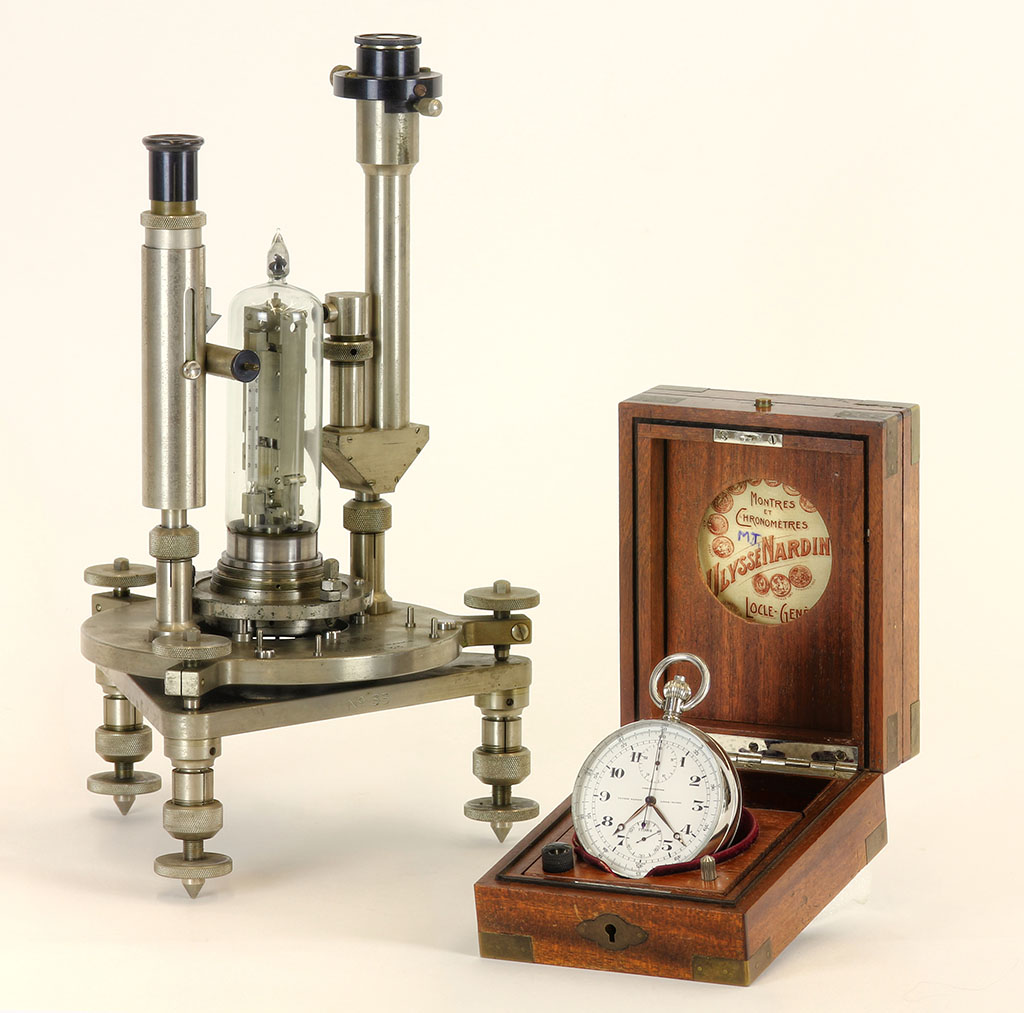 sThe Holweck-Lejay gravimeter is shown on the left and the Ullysses Nardin 17984 chronometer is shown on the right.