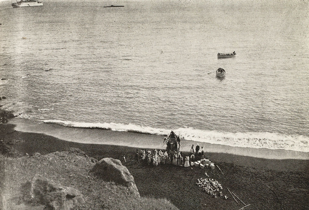 Disembarking at Tristan da Cunha with the K-XVII and the Empress of Britain in the background.
